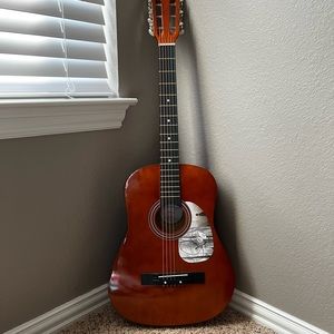 Acoustic guitar signed by taylor swift